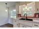 Kitchen sink featuring a modern black faucet and bright pendant lights at 38320 14Th Ave, Zephyrhills, FL 33542