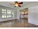 Open living room, adjacent to kitchen, with bright sunlight and spacious area at 38320 14Th Ave, Zephyrhills, FL 33542