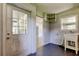 Mud room with access to porch, house, and a convenient utility sink at 38320 14Th Ave, Zephyrhills, FL 33542