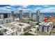 Aerial view of a modern high-rise condominium in a vibrant city setting with a red arrow for emphasis at 400 4Th S Ave # 301, St Petersburg, FL 33701