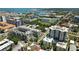Aerial view of a condominium complex surrounded by lush greenery and city buildings, showcasing its location at 400 4Th S Ave # 301, St Petersburg, FL 33701