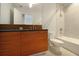 Modern bathroom featuring a vanity with dark countertop and a tiled shower/tub combination at 400 4Th S Ave # 301, St Petersburg, FL 33701