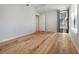 Spacious bedroom featuring hardwood floors and a large window at 400 4Th S Ave # 301, St Petersburg, FL 33701