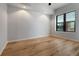 Bright bedroom with hardwood floors, and large window with blinds at 400 4Th S Ave # 301, St Petersburg, FL 33701