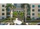 Beautiful condo entrance with tropical palm trees and a water feature surrounded by manicured landscaping at 400 4Th S Ave # 301, St Petersburg, FL 33701