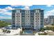 Modern high-rise condominium with balconies, a rooftop pool, and well-manicured greenery at 400 4Th S Ave # 301, St Petersburg, FL 33701