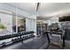 Bright gym with a treadmill, weight rack, and floor-to-ceiling windows overlooking the terrace at 400 4Th S Ave # 301, St Petersburg, FL 33701