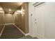 Inviting hallway featuring neutral tones, modern sconces and carpeted flooring at 400 4Th S Ave # 301, St Petersburg, FL 33701