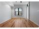 Bright living room with hardwood floors and a large window with blinds at 400 4Th S Ave # 301, St Petersburg, FL 33701