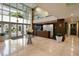 Beautiful condo lobby featuring travertine floors, high ceilings, large windows, and tasteful decor at 400 4Th S Ave # 301, St Petersburg, FL 33701