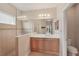 Elegant bathroom with double vanity, large mirror, and glass-enclosed shower offering a luxurious feel at 4020 Cottage Hill Ave, Parrish, FL 34219