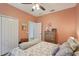 Cozy bedroom with a wooden dresser, and bright natural light creating a relaxing atmosphere at 4020 Cottage Hill Ave, Parrish, FL 34219