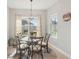 Cozy dining area with a glass table, stylish chairs, and natural lighting at 4020 Cottage Hill Ave, Parrish, FL 34219