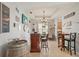 Charming dining area features a custom bar, unique decor, and ample seating with stylish counter stools at 4020 Cottage Hill Ave, Parrish, FL 34219
