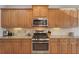 Well-equipped kitchen with stainless steel appliances, granite counters, and ample cabinet space at 4020 Cottage Hill Ave, Parrish, FL 34219