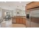 Modern kitchen showcasing granite countertops, stainless steel appliances, and tile flooring at 4020 Cottage Hill Ave, Parrish, FL 34219