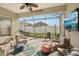 Inviting screened patio with comfortable seating, outdoor kitchen, and relaxing atmosphere at 4020 Cottage Hill Ave, Parrish, FL 34219