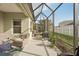 Inviting screened patio with comfortable seating, outdoor kitchen, and relaxing atmosphere at 4020 Cottage Hill Ave, Parrish, FL 34219