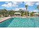 Community pool with clear blue water, ample seating, and shaded cabanas at 4020 Cottage Hill Ave, Parrish, FL 34219