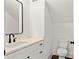 Modern half bathroom featuring updated sink, vanity, toilet, and fixtures at 406 E Selma Ave, Tampa, FL 33603