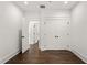Bedroom featuring wood floors, a closet, and white trim at 406 E Selma Ave, Tampa, FL 33603