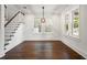 Dining area boasting hardwood floors, modern lighting, and staircase access at 406 E Selma Ave, Tampa, FL 33603