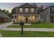Charming two-story home featuring a welcoming front porch with stylish stone accents at 406 E Selma Ave, Tampa, FL 33603