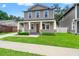 Beautiful two-story house with a spacious front yard and inviting covered porch at 406 E Selma Ave, Tampa, FL 33603