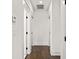 Bright hallway with dark hardwood floors and white trim throughout at 406 E Selma Ave, Tampa, FL 33603