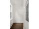 Hallway with wood flooring and white walls, with an electrical panel at 406 E Selma Ave, Tampa, FL 33603