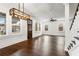 Spacious living room features hardwood floors, natural light, and a modern ceiling fan at 406 E Selma Ave, Tampa, FL 33603