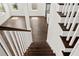 View from the top of the staircase into an open concept living space featuring hardwood floors at 406 E Selma Ave, Tampa, FL 33603
