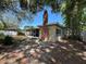 Backyard of house with patio, chimney, and bamboo at 422 Crosswinds Dr, Palm Harbor, FL 34683