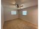 Serene bedroom featuring tile flooring and natural light from the windows at 422 Crosswinds Dr, Palm Harbor, FL 34683