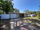 Charming single-story home with a driveway, attached garage, and well-maintained front lawn at 422 Crosswinds Dr, Palm Harbor, FL 34683