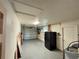 Spacious garage with an overhead door and ample room for storage at 422 Crosswinds Dr, Palm Harbor, FL 34683