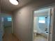 Hallway leading to a bathroom and bedrooms at 422 Crosswinds Dr, Palm Harbor, FL 34683