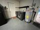 Convenient laundry area with washer, dryer, and water heater at 422 Crosswinds Dr, Palm Harbor, FL 34683