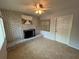 Cozy room with a brick fireplace and a decorative painting above the fireplace at 422 Crosswinds Dr, Palm Harbor, FL 34683
