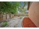 Spacious fenced backyard with a stone path at 4744 Burlington Rd, Land O Lakes, FL 34639