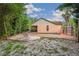 Beautiful backyard featuring a pool with sun-loungers and lush landscaping at 4744 Burlington Rd, Land O Lakes, FL 34639