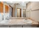 Bathroom featuring double sinks, large mirror and a full view of other areas of the home at 4744 Burlington Rd, Land O Lakes, FL 34639