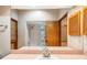 Bathroom featuring shower and bathtub, tiled flooring, and neutral paint at 4744 Burlington Rd, Land O Lakes, FL 34639