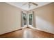 Cozy bedroom featuring wood-look floors, neutral walls, and a ceiling fan at 4744 Burlington Rd, Land O Lakes, FL 34639