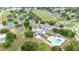 Community pool is adjacent to tennis courts and playground at 4744 Burlington Rd, Land O Lakes, FL 34639