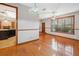 Dining room with hardwood floors adjacent to the kitchen, offering an open and inviting layout at 4744 Burlington Rd, Land O Lakes, FL 34639