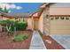 Welcoming front entrance with desert landscaping and a pathway leading to the door at 4744 Burlington Rd, Land O Lakes, FL 34639