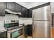 Close up shot of kitchen with stainless steel oven, stove and refrigerator at 4744 Burlington Rd, Land O Lakes, FL 34639