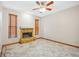 Cozy living area with a stone fireplace, tile floors, and natural light from window blinds at 4744 Burlington Rd, Land O Lakes, FL 34639