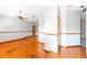 Bright living room with hardwood floors, neutral walls, and inviting natural light showcasing space at 4744 Burlington Rd, Land O Lakes, FL 34639